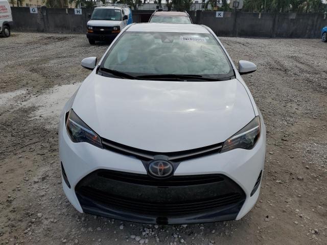 Photo 4 VIN: 5YFBURHE8KP878947 - TOYOTA COROLLA L 