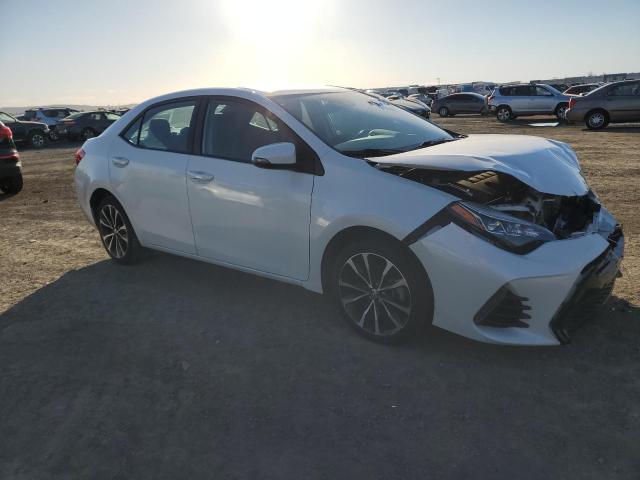 Photo 3 VIN: 5YFBURHE8KP892783 - TOYOTA COROLLA L 