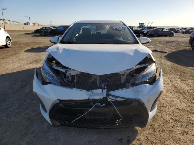 Photo 4 VIN: 5YFBURHE8KP892783 - TOYOTA COROLLA L 