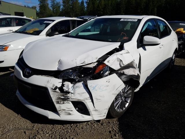 Photo 1 VIN: 5YFBURHE9EP101360 - TOYOTA COROLLA L 