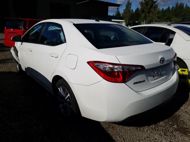 Photo 2 VIN: 5YFBURHE9EP101360 - TOYOTA COROLLA L 