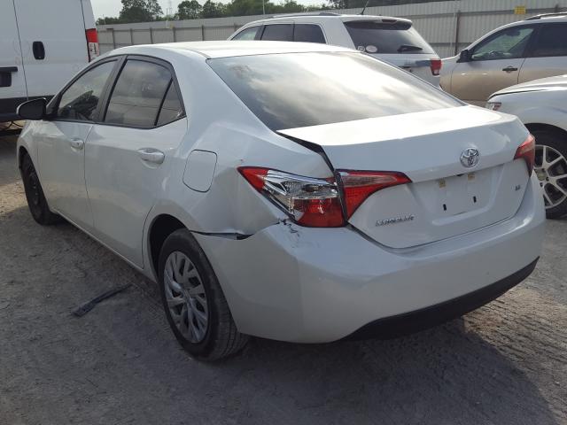 Photo 2 VIN: 5YFBURHE9HP657009 - TOYOTA COROLLA L 