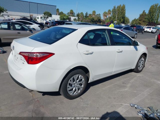 Photo 3 VIN: 5YFBURHE9JP748027 - TOYOTA COROLLA 