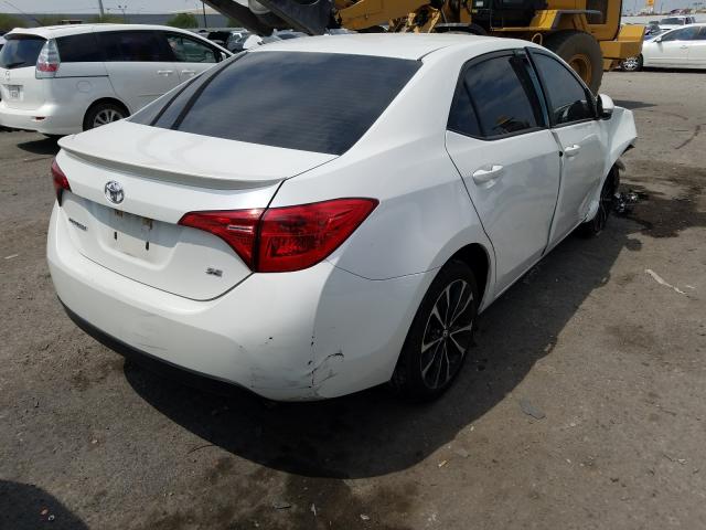 Photo 3 VIN: 5YFBURHE9JP756077 - TOYOTA COROLLA L 