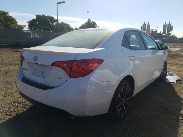 Photo 3 VIN: 5YFBURHE9JP759464 - TOYOTA COROLLA L 