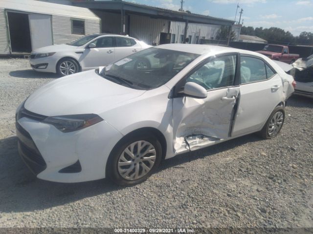 Photo 1 VIN: 5YFBURHE9KP869545 - TOYOTA COROLLA 