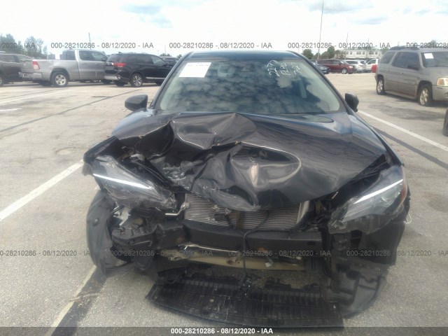 Photo 5 VIN: 5YFBURHE9KP882277 - TOYOTA COROLLA 