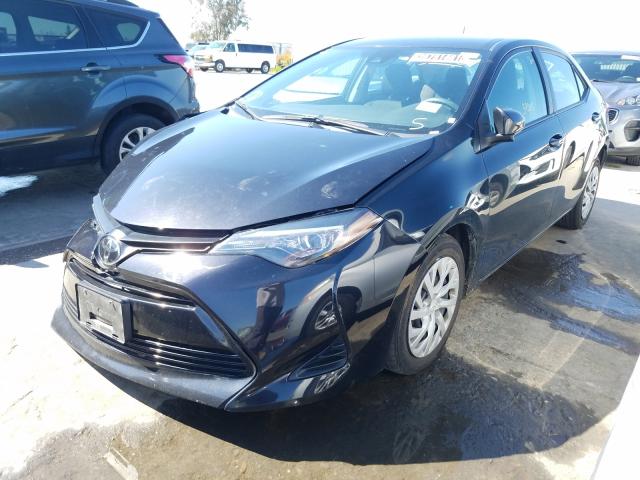 Photo 1 VIN: 5YFBURHE9KP885129 - TOYOTA COROLLA L 