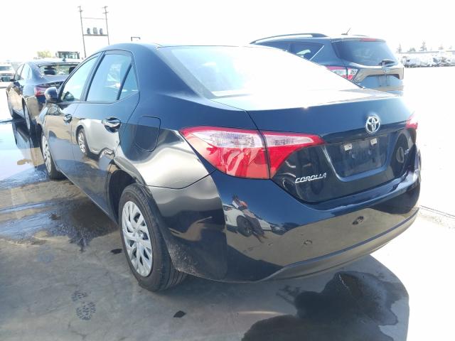 Photo 2 VIN: 5YFBURHE9KP885129 - TOYOTA COROLLA L 