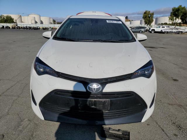 Photo 4 VIN: 5YFBURHE9KP919473 - TOYOTA COROLLA L 