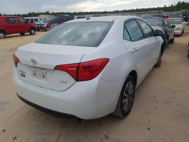 Photo 3 VIN: 5YFBURHEXJP746562 - TOYOTA COROLLA L 