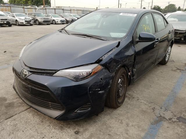 Photo 1 VIN: 5YFBURHEXJP769677 - TOYOTA COROLLA L 