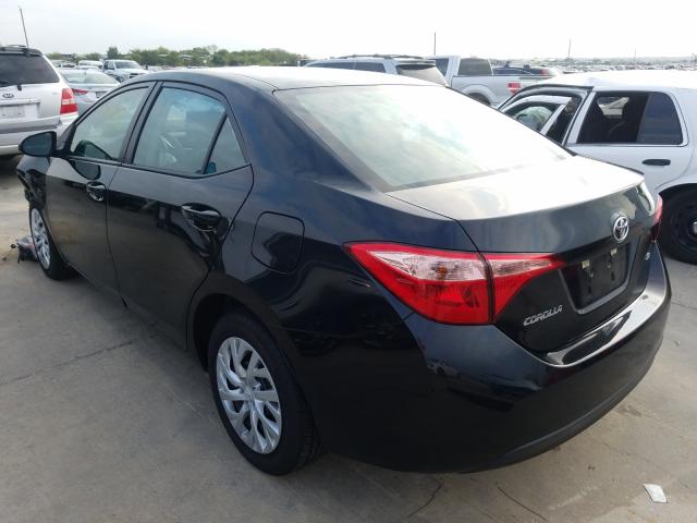 Photo 2 VIN: 5YFBURHEXKP894938 - TOYOTA COROLLA L 