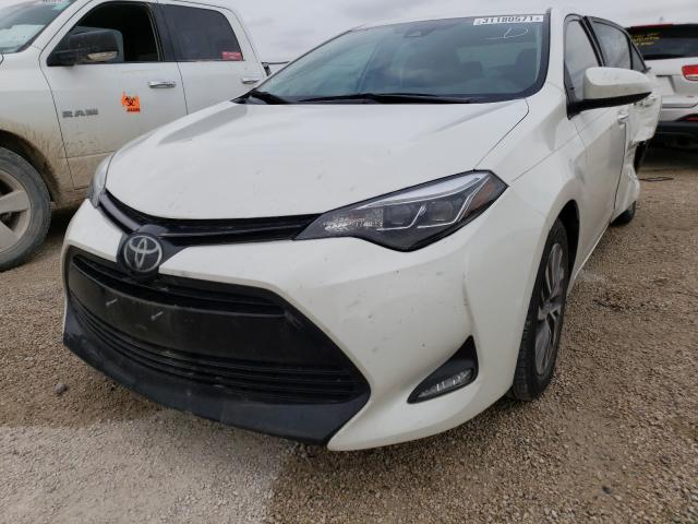 Photo 1 VIN: 5YFBURHEXKP948609 - TOYOTA COROLLA L 