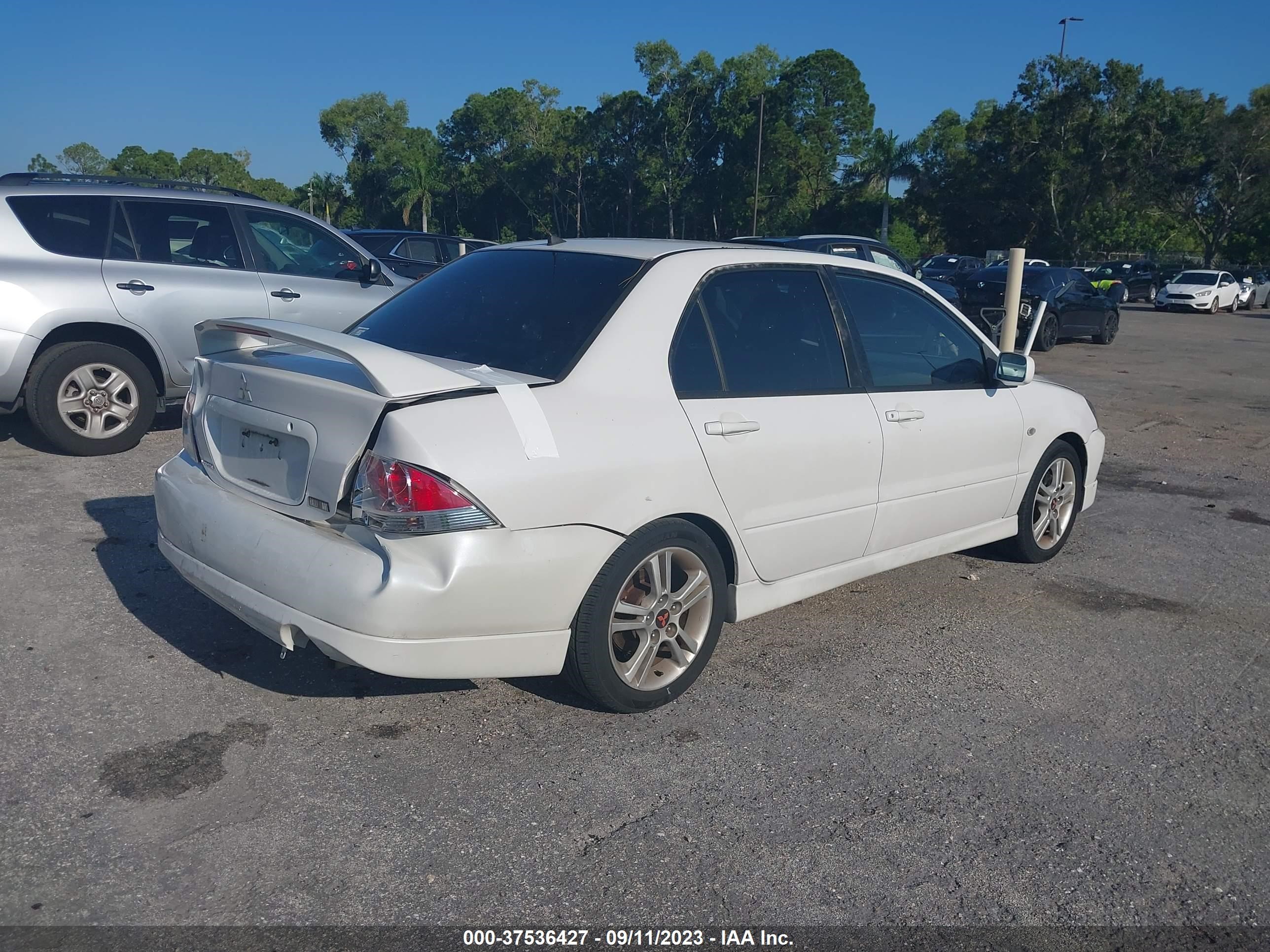 Photo 3 VIN: JA3AJ66FX4U042186 - MITSUBISHI LANCER 