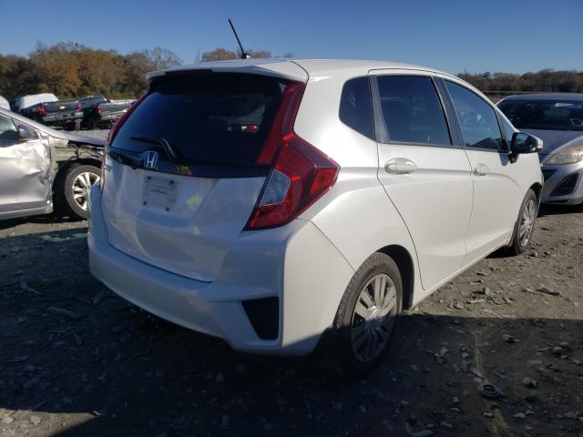 Photo 3 VIN: JHMGK5H54GX027286 - HONDA FIT LX 