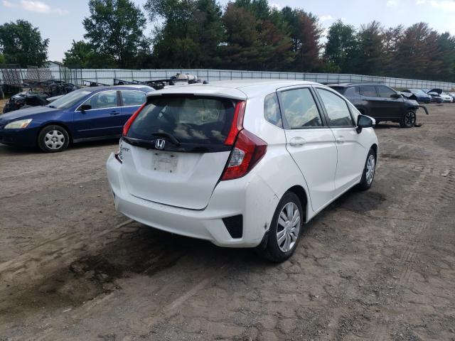 Photo 3 VIN: JHMGK5H59GX040972 - HONDA FIT LX 