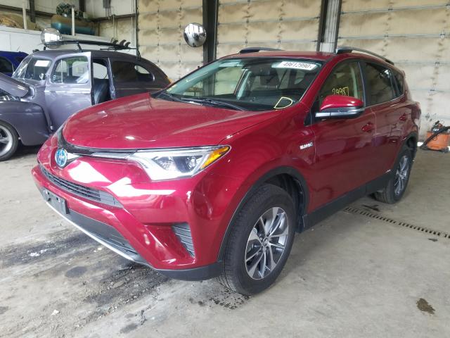 Photo 1 VIN: JTMRJREV0JD173377 - TOYOTA RAV4 HV LE 