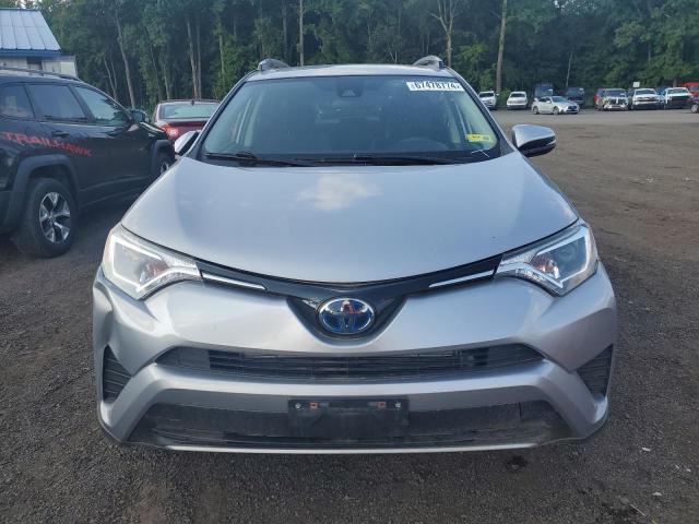 Photo 4 VIN: JTMRJREV0JD233688 - TOYOTA RAV4 HV LE 