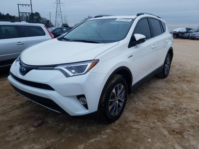 Photo 1 VIN: JTMRJREV2JD171386 - TOYOTA RAV4 HV LE 