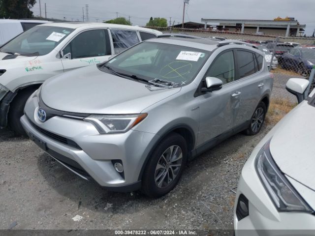 Photo 1 VIN: JTMRJREV3GD004611 - TOYOTA RAV4 HYBRID 