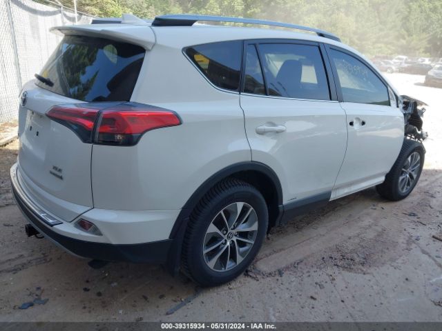 Photo 3 VIN: JTMRJREV7JD248477 - TOYOTA RAV4 HYBRID 