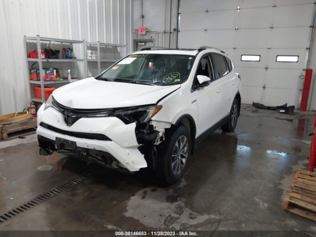 Photo 1 VIN: JTMRJREV8GD034073 - TOYOTA RAV4 HYBRID 