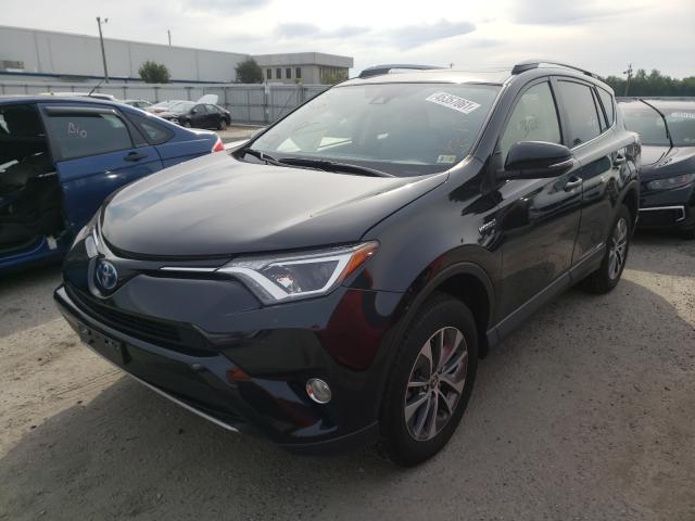 Photo 1 VIN: JTMRJREV9JD180229 - TOYOTA RAV4 HV LE 