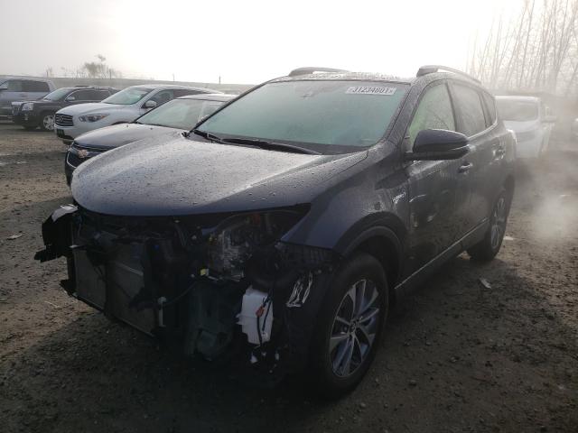 Photo 1 VIN: JTMRJREV9JD215870 - TOYOTA RAV4 HV LE 