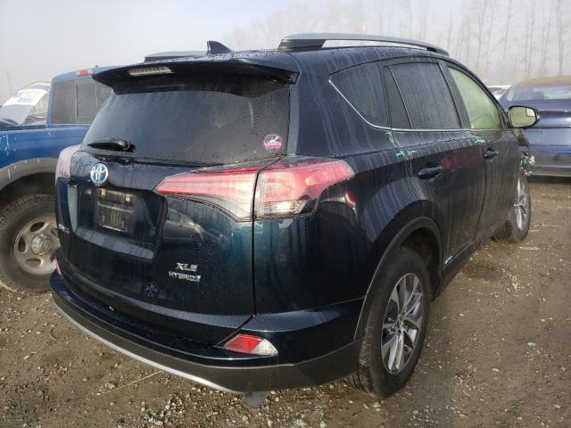 Photo 3 VIN: JTMRJREV9JD215870 - TOYOTA RAV4 HV LE 