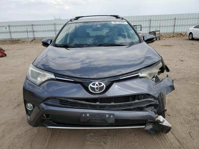 Photo 4 VIN: JTMWFREV4GJ097709 - TOYOTA RAV4 XLE 