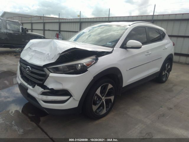 Photo 1 VIN: KM8J3CA24GU052646 - HYUNDAI TUCSON 