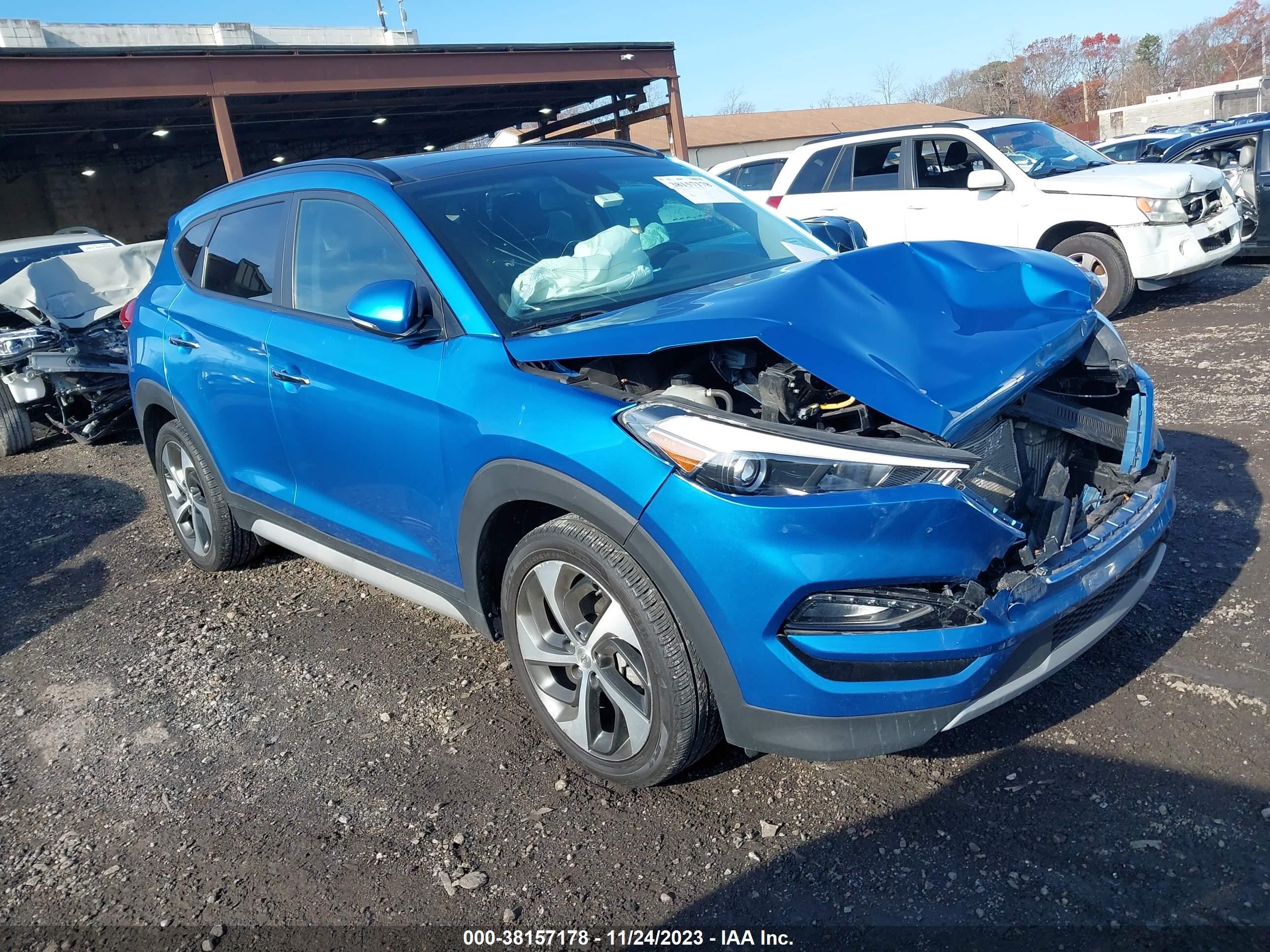 Photo 0 VIN: KM8J3CA26JU702469 - HYUNDAI TUCSON 