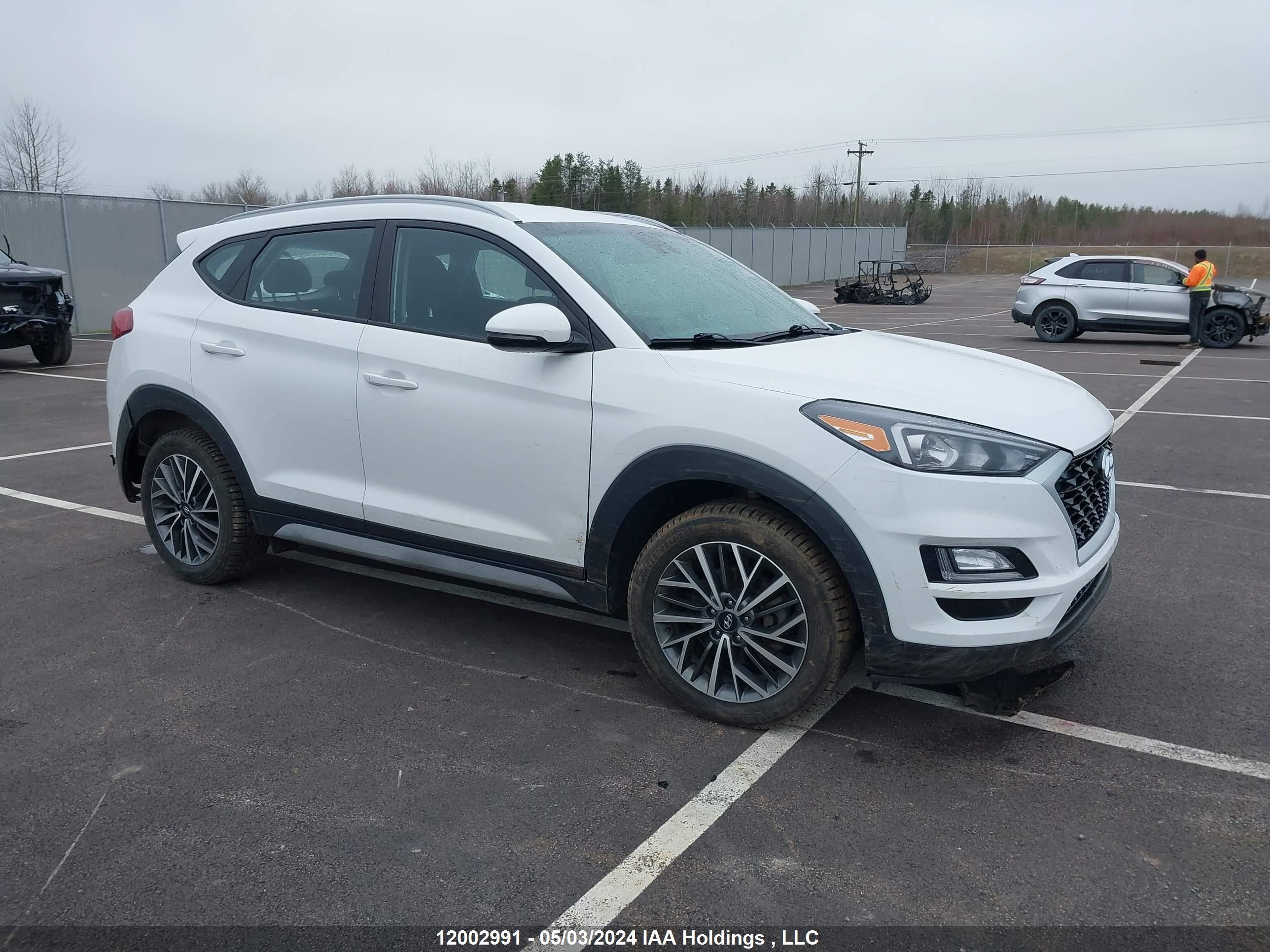 Photo 0 VIN: KM8J3CA40KU976821 - HYUNDAI TUCSON 