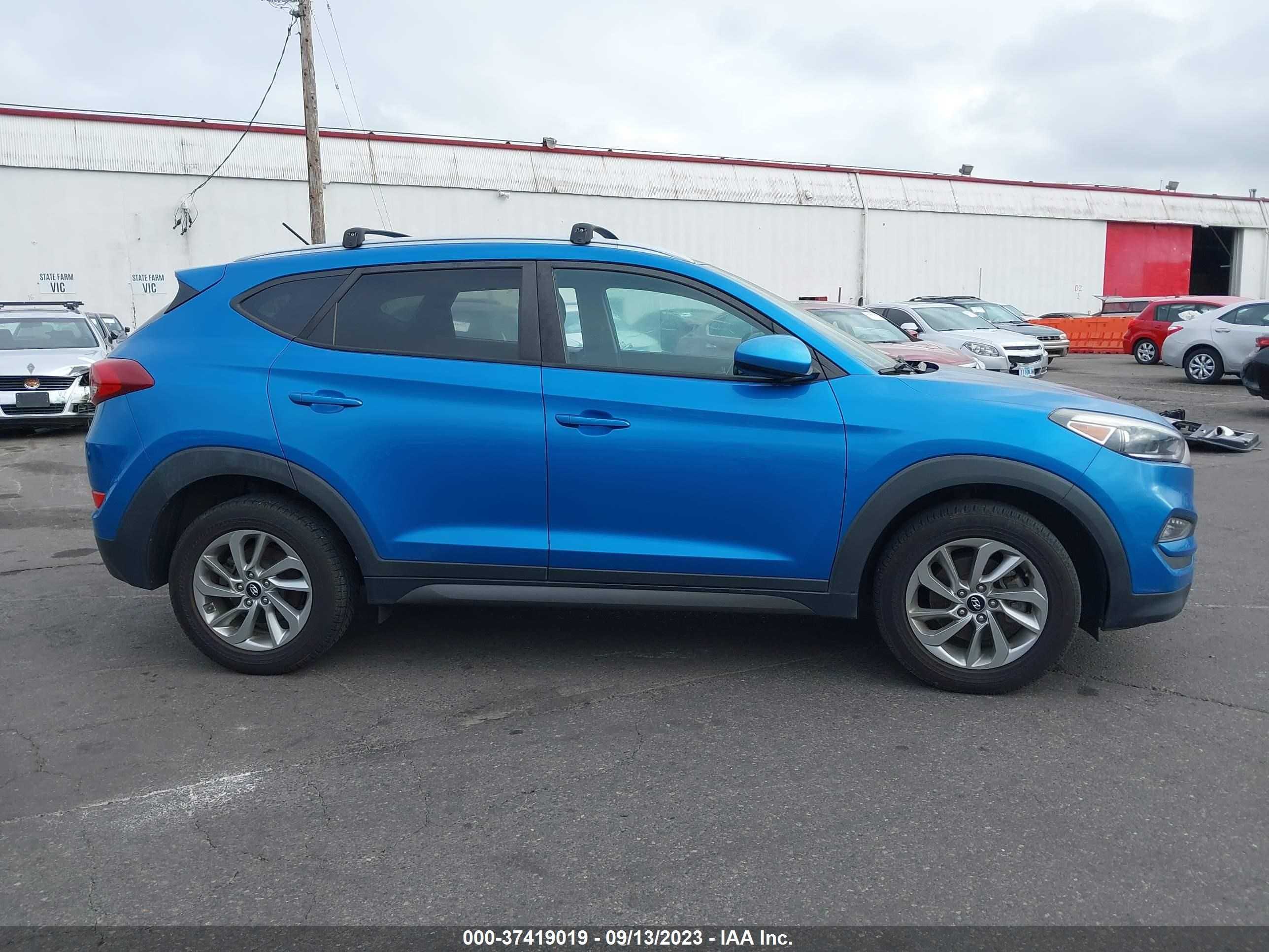 Photo 12 VIN: KM8J3CA41GU173636 - HYUNDAI TUCSON 