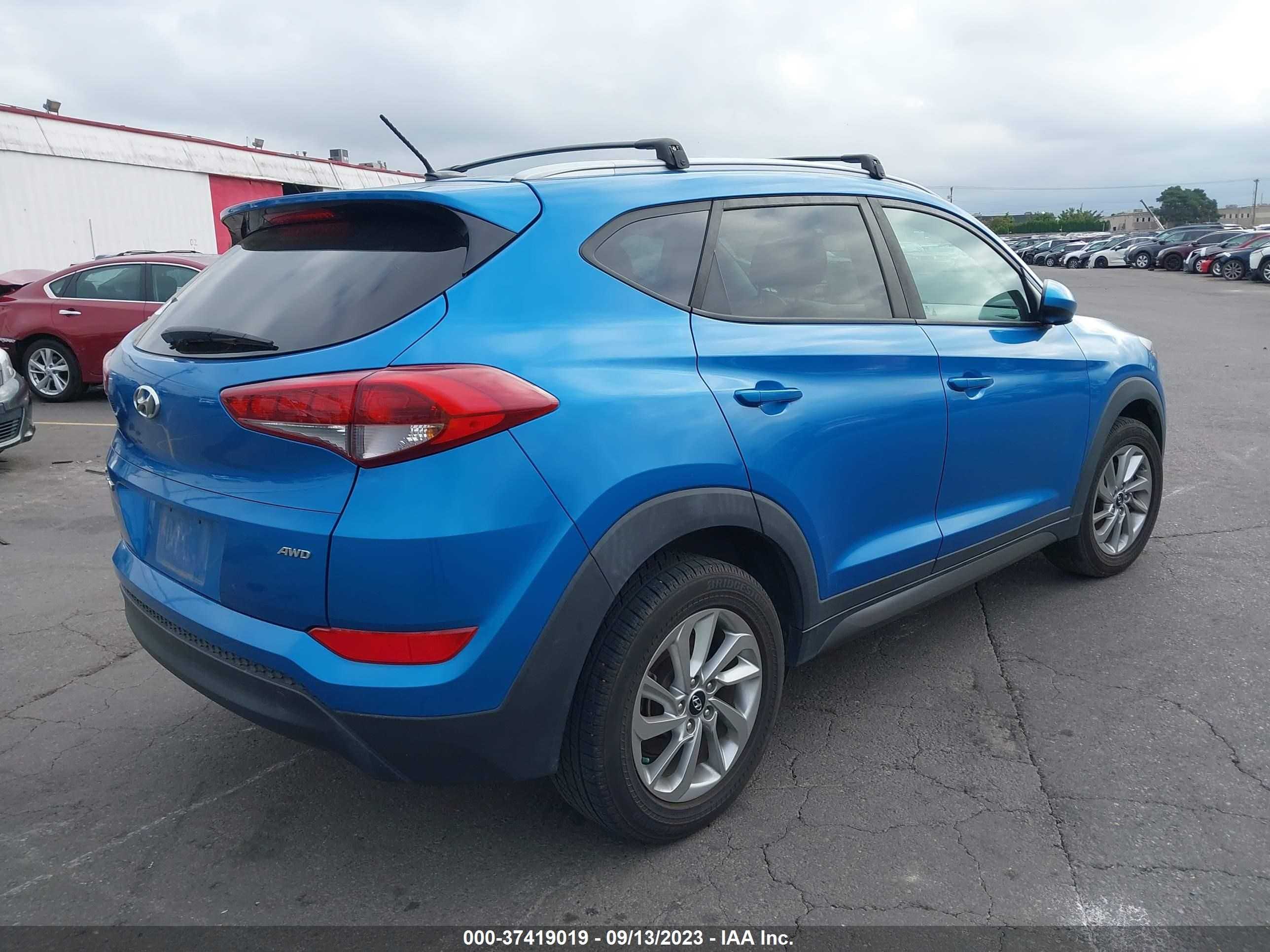 Photo 3 VIN: KM8J3CA41GU173636 - HYUNDAI TUCSON 