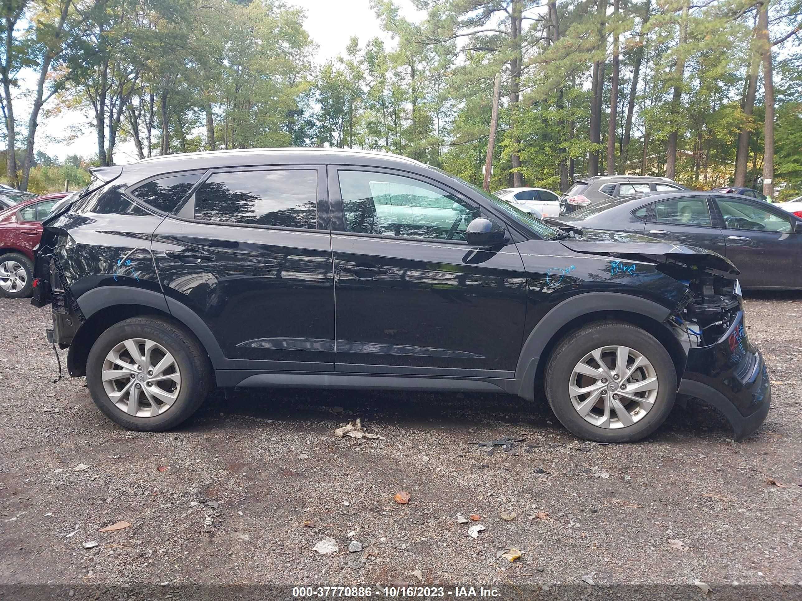 Photo 12 VIN: KM8J3CA42LU157049 - HYUNDAI TUCSON 