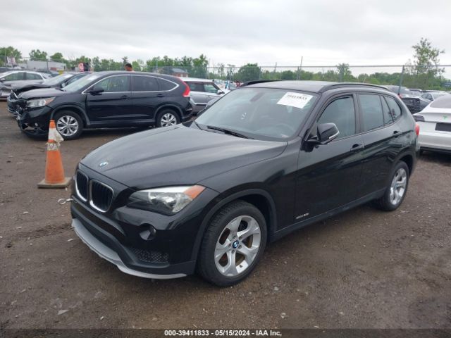 Photo 1 VIN: WBAVM1C51FV319228 - BMW X1 