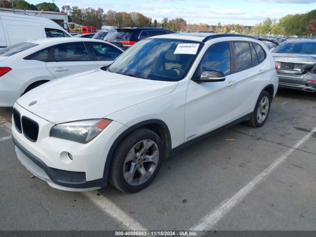 Photo 1 VIN: WBAVM1C51FV498256 - BMW X1 