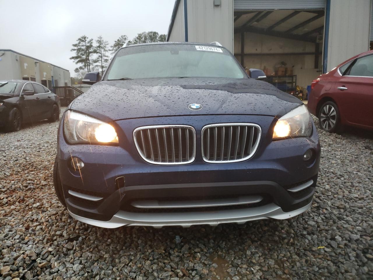 Photo 4 VIN: WBAVM1C52FV498704 - BMW X1 