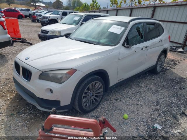 Photo 1 VIN: WBAVM1C5XFVW56996 - BMW X1 