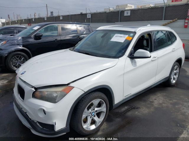 Photo 1 VIN: WBAVM1C5XFVW57999 - BMW X1 