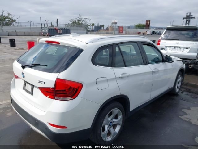 Photo 3 VIN: WBAVM1C5XFVW57999 - BMW X1 