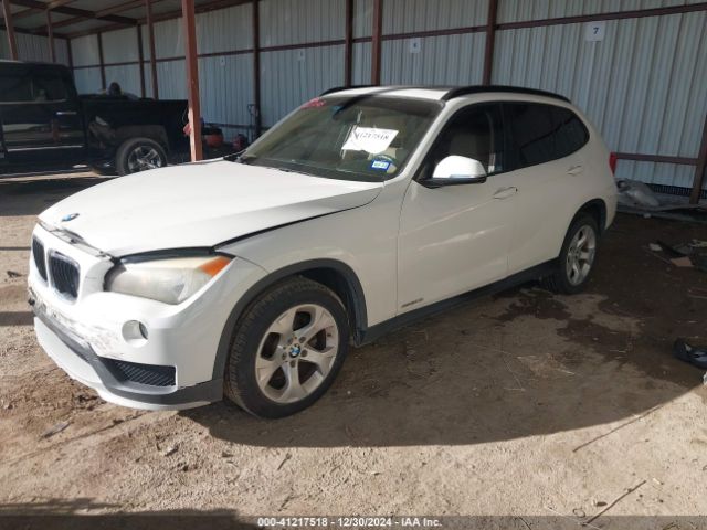 Photo 1 VIN: WBAVM1C5XFVZ94253 - BMW X1 