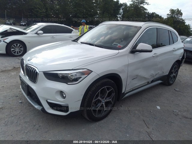 Photo 1 VIN: WBXHT3C30G5E54642 - BMW X1 