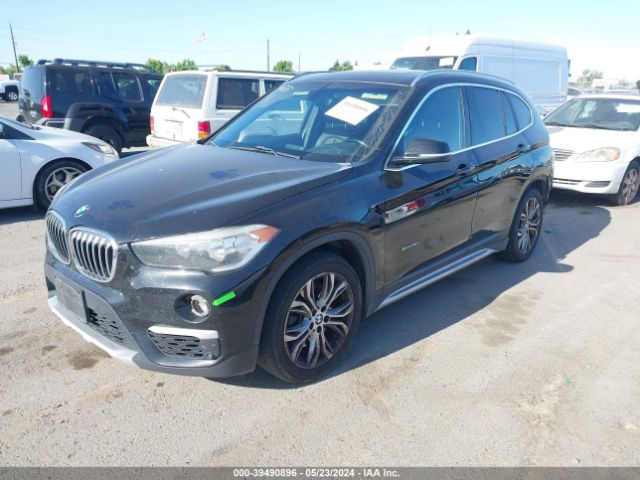 Photo 1 VIN: WBXHT3C30G5E56682 - BMW X1 