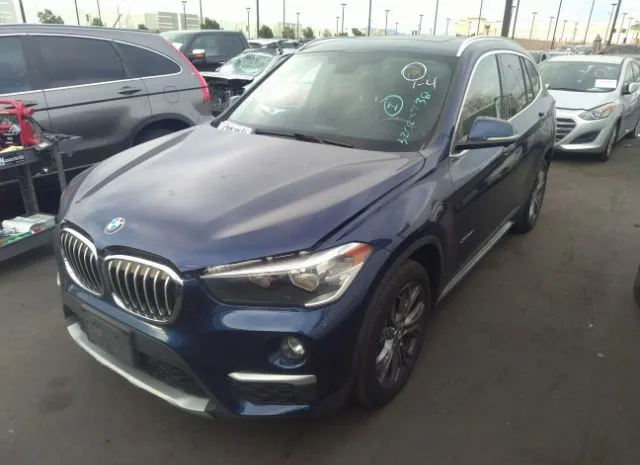 Photo 1 VIN: WBXHT3C31G5E56156 - BMW X1 