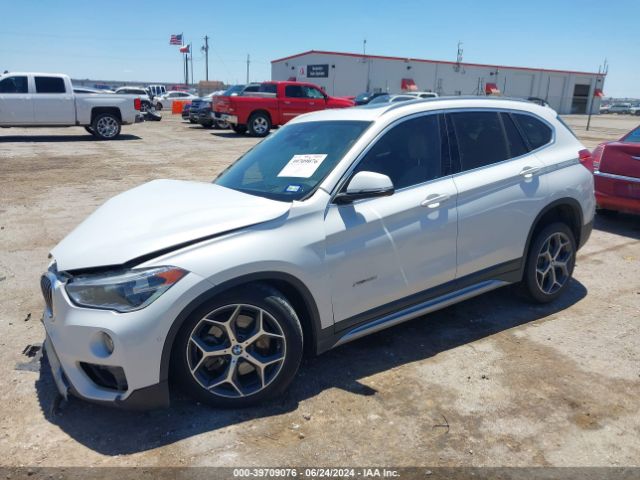 Photo 1 VIN: WBXHT3C31G5F64518 - BMW X1 