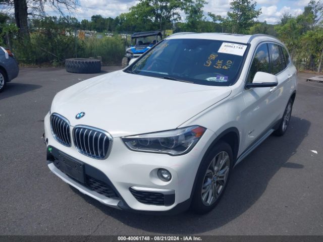 Photo 1 VIN: WBXHT3C32G5E56375 - BMW X1 