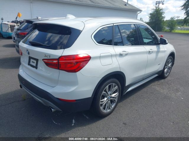 Photo 3 VIN: WBXHT3C32G5E56375 - BMW X1 